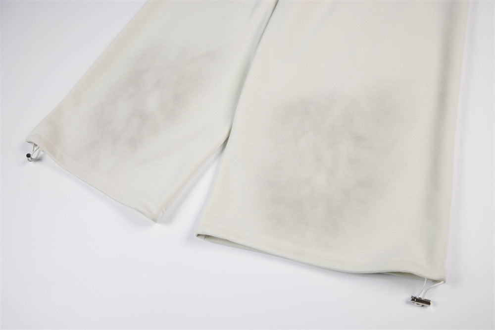 Pantalon de survêtement à jambes larges motif baroque – Imprimé usé, ceinture à étoiles