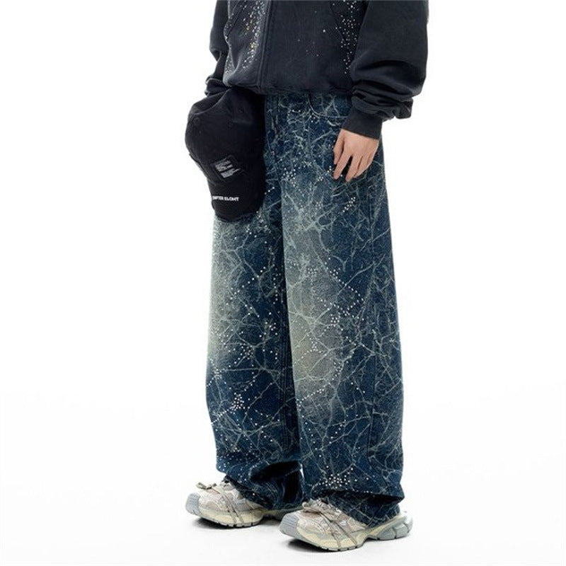 Side view of wide-leg vintage wash jeans with rhinestone constellation detailing