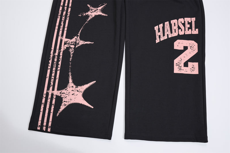 Pantalones de chándal de pierna ancha con estampado gráfico varsity y cintura rosa en contraste