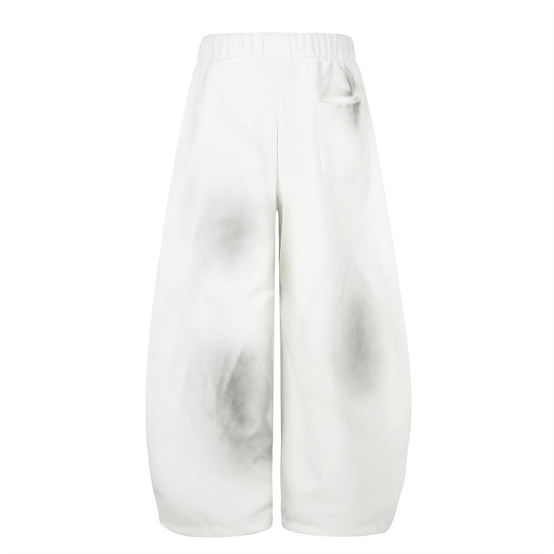 Pantalones de chándal holgados de pernera ancha con lavado efecto spray y gráfico de letras