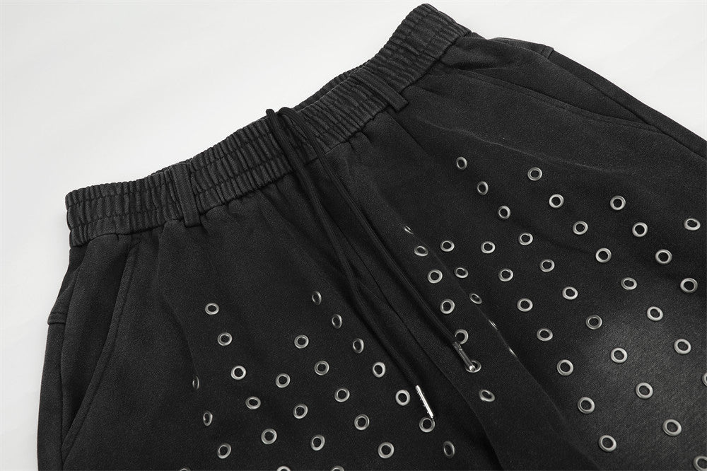 Pantalon de survêtement ample à œillets métalliques, finition délavée à l’acide & ourlet brut