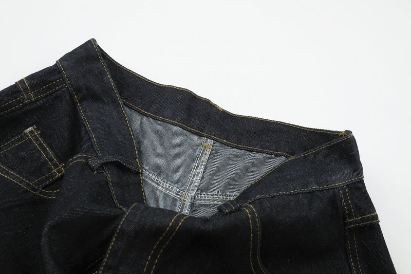 Jean baggy délavé foncé avec bas en fausse fourrure et broderie manuscrite – Coupe ample
