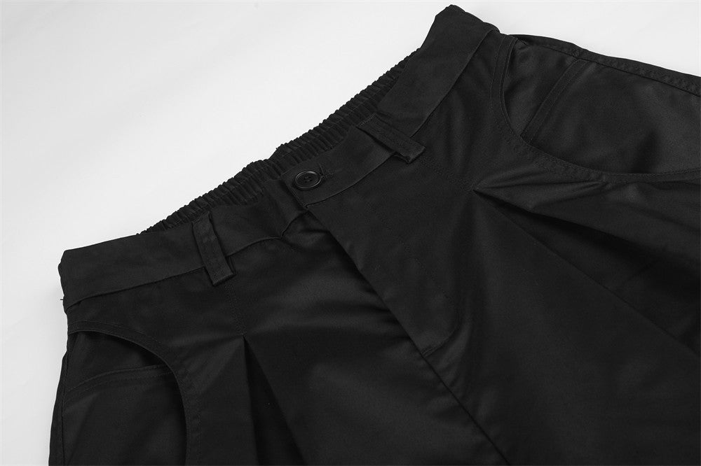 Wide-Leg Pleated Trousers – Oversized Silhouette with Curved Hem