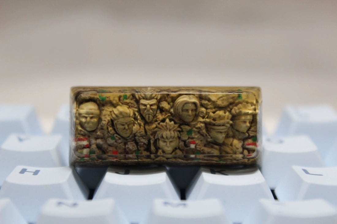 The Hokage Monument Keycap by Naruto is a custom spacebar keycap featuring carved Hokage faces. It boasts a detailed beige and brown design that fits Cherry MX switches on white keyboards, perfect for any fan of Naruto.