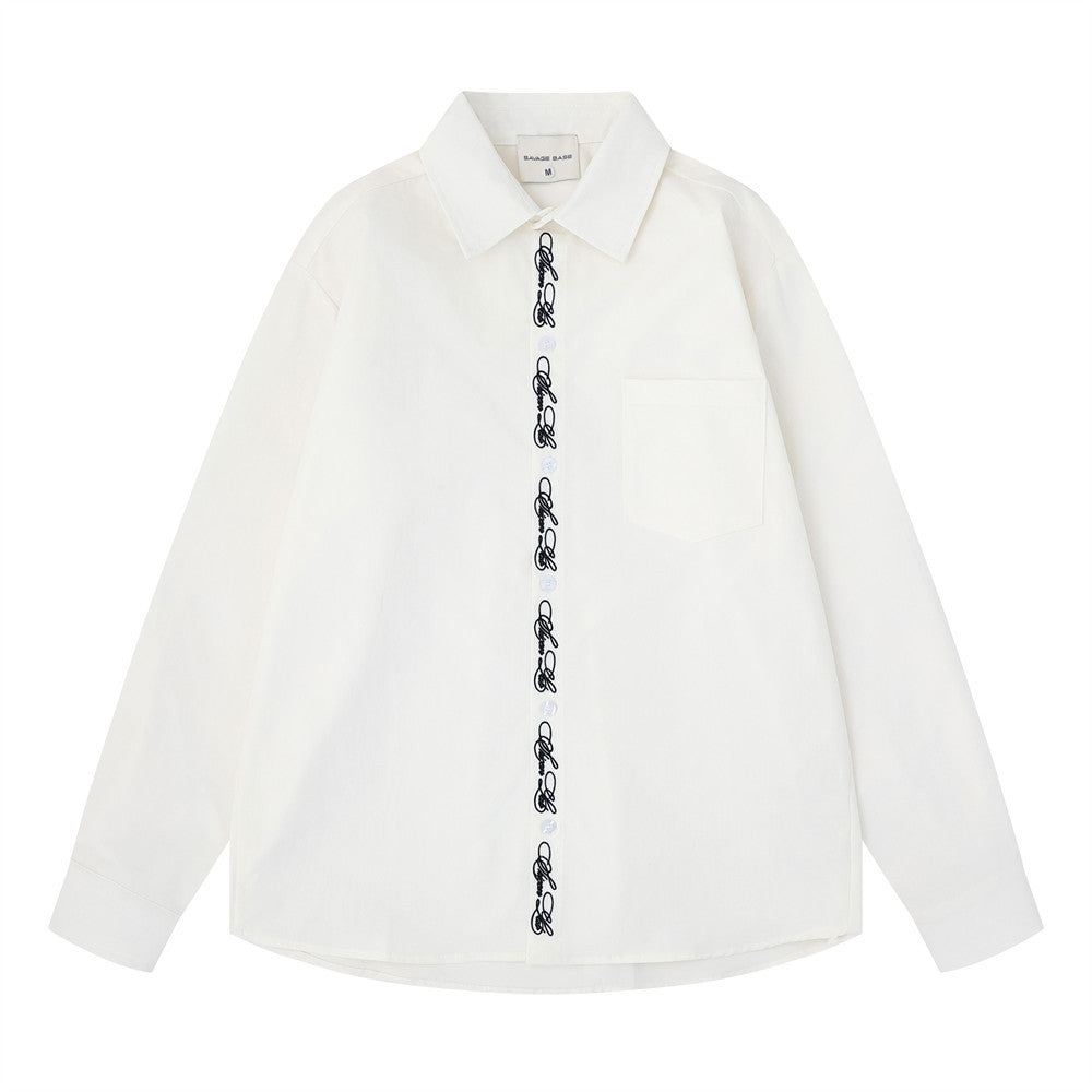White oversized long sleeve button-down shirt front view with script embroidery placket and chest pocket