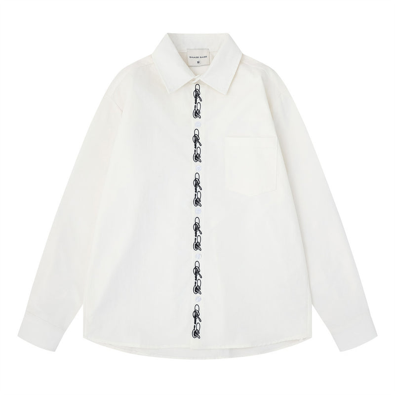 White oversized long sleeve button-down shirt front view with script embroidery placket and chest pocket