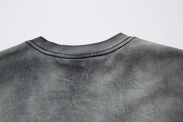 The back of the Limited Edition Death Note Long Sleeve Shirt in a black & gray gradient with distressed design and artistic hem showcases the neckline and shoulders, embodying anime streetwear style.