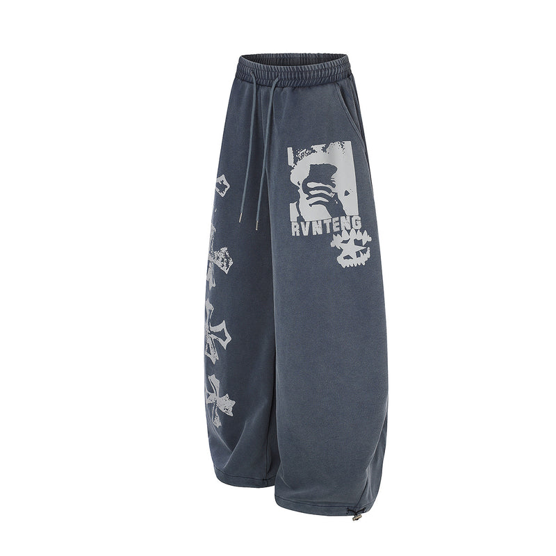 Pantalones de chándal de pierna ancha con cruz estampada y acabado lavado ácido