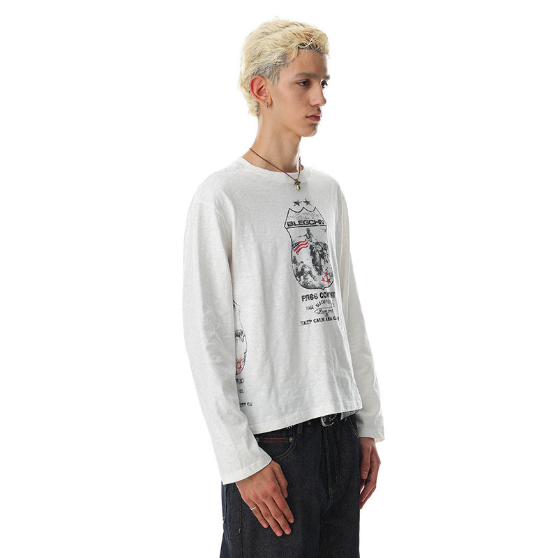 White long sleeve oversized tee with front graphic print, side view on model