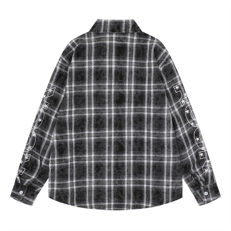 Back view of a black plaid oversized flannel shirt with white sleeve graphics