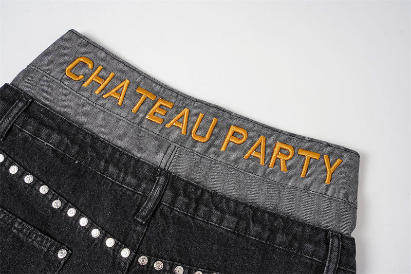 Back waistband close-up with gold letter embroidery reading CHATEAU PARTY