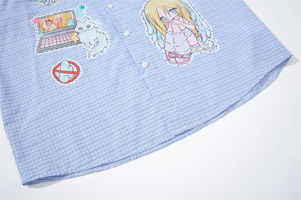 Blue plaid shirt hem close-up with anime graphics near the lower front
