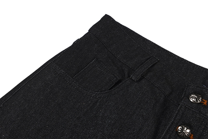 Jean droit noir brut à boutons-pression latéraux