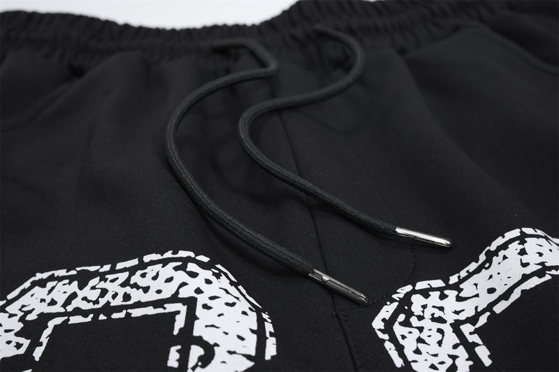 Pantalon de survêtement à jambes larges avec imprimé numéro universitaire et étoile