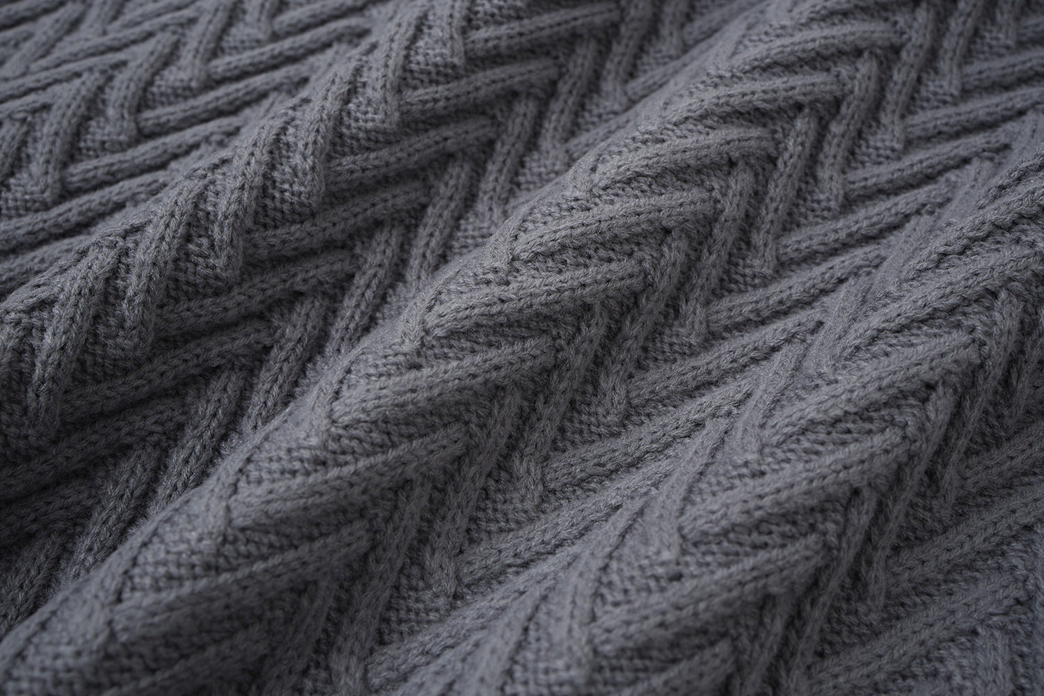 Cardigan en maille torsadée chevrons avec col châle et poches avant