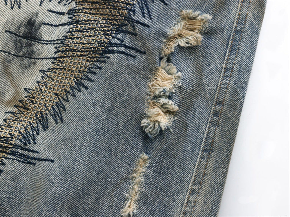 Baggy Wide-Leg Jeans – Chaotic Embroidery, Distressed Denim & Arc-Hem Design