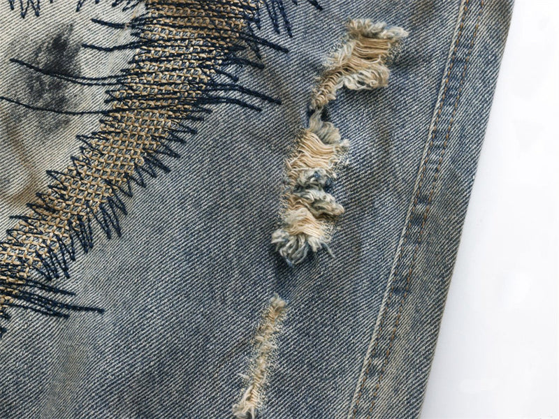Baggy Wide-Leg Jeans – Chaotic Embroidery, Distressed Denim & Arc-Hem Design