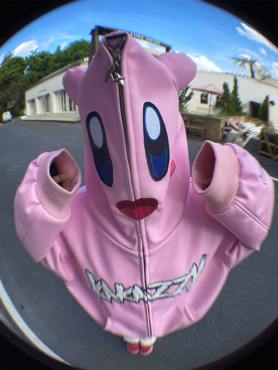 A streetwear fan wears a Seakoff Kirby Pink Hoodie zipped over their face, showcasing a cartoon character&