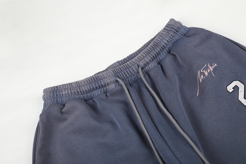 Pantalon de survêtement à jambes larges avec broderies graffiti signature et numéro 26
