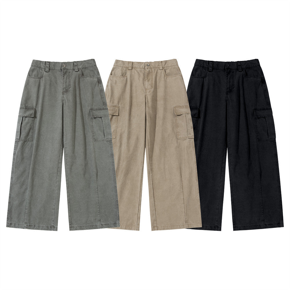 Men's baggy wide-leg cargo pants in washed army green with large flap thigh pockets and straight leg silhouette