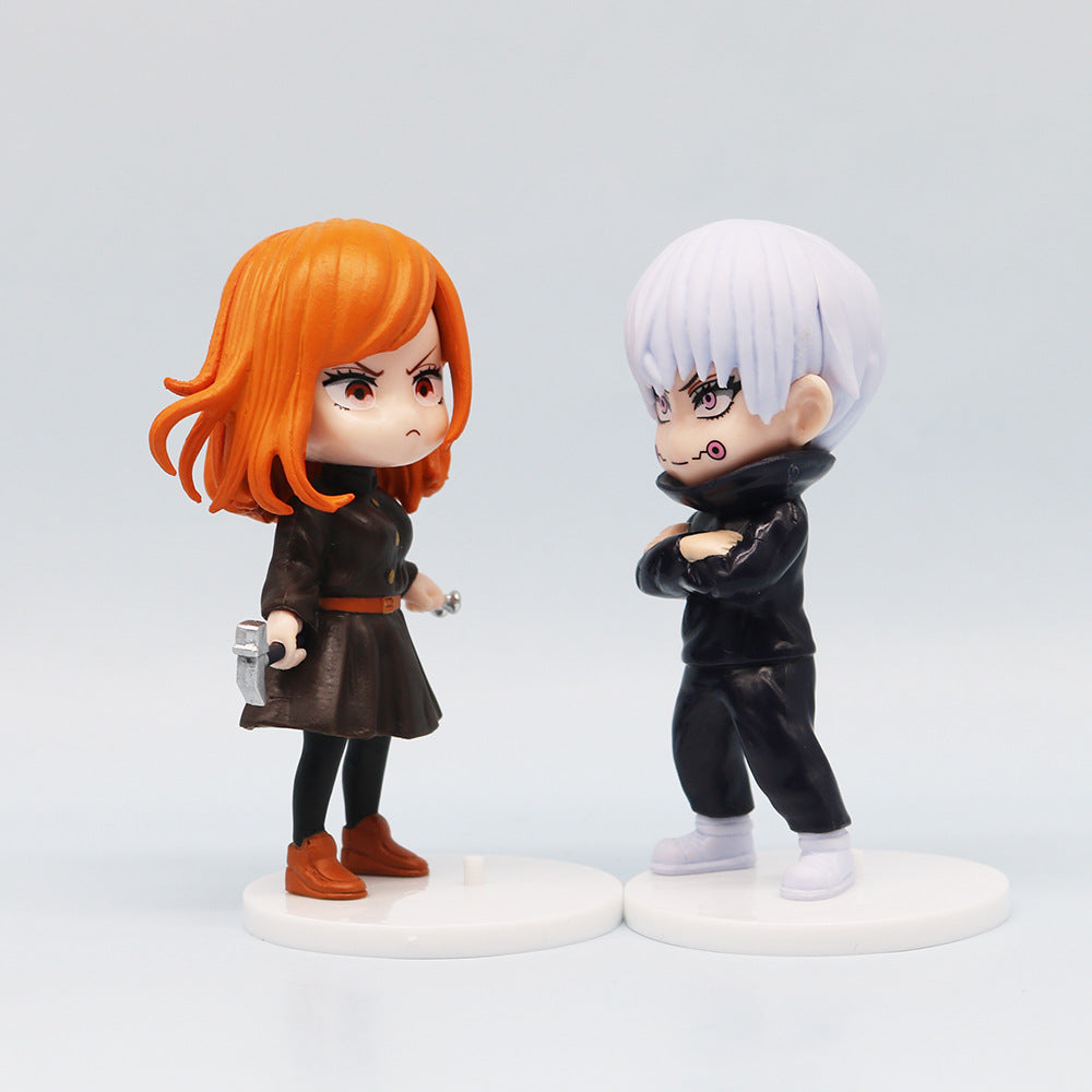 Two chibi-style figures from the Jujutsu Kaisen Q Edition Spell Return 7-Piece PVC Set stand facing each other. One has orange hair holding a tool, and the other white-haired with crossed arms. Both wear dark outfits and are on small white bases, perfect for any collection.