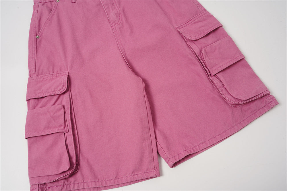 Front lower leg view of rose pink cargo shorts with flap cargo pockets