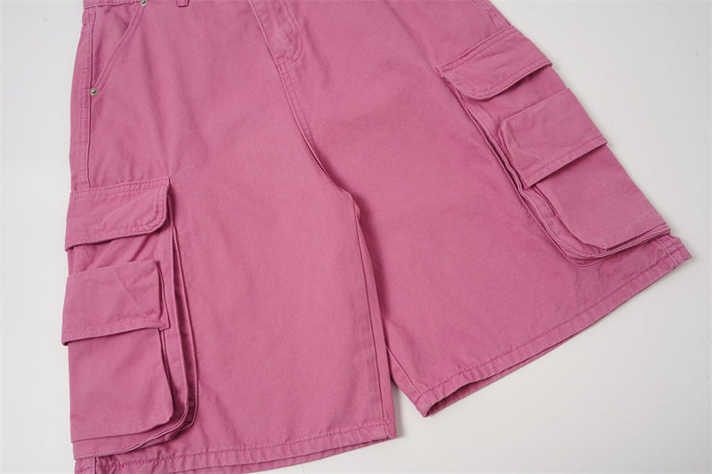 Front lower leg view of rose pink cargo shorts with flap cargo pockets