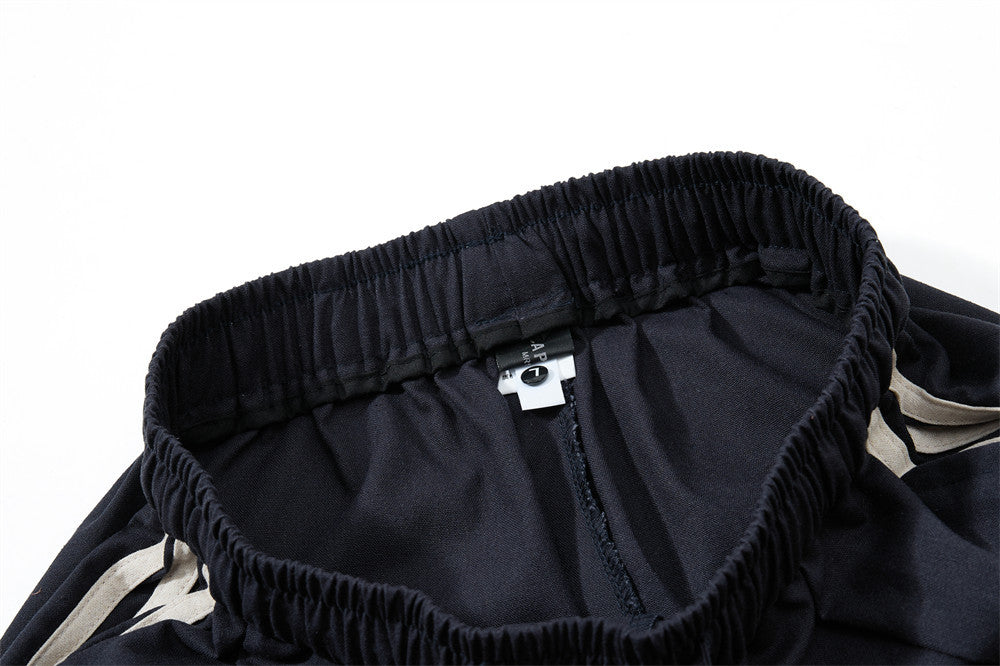 Pantalon de survêtement wide leg – Triple bande latérale, taille élastique à cordon