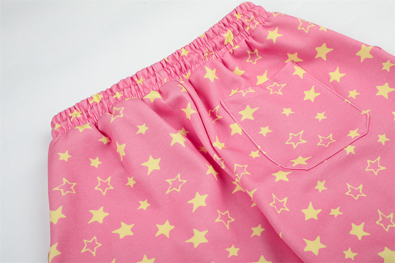 Close-up of pink star print sweatpants back pocket and elastic waistband