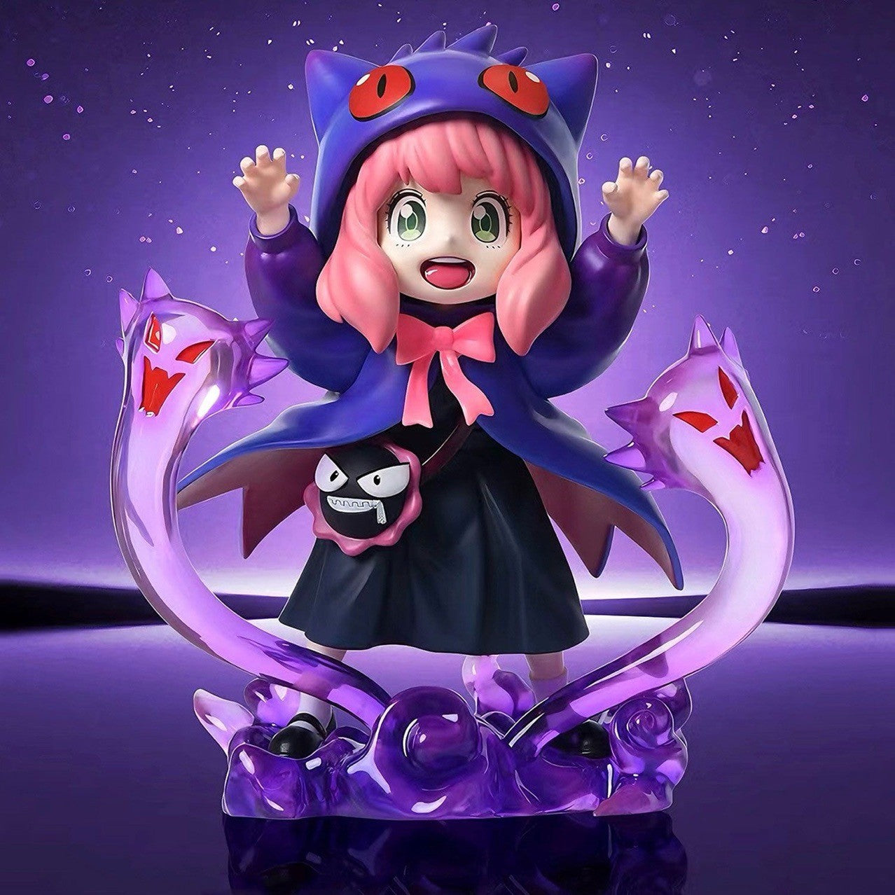 A 17 cm Spy x Family Anya Forger PVC figure, featuring a smiling child with pink hair in a purple cat-eared hoodie and black outfit with a pink bow, is framed by purple snake-like creatures on a glossy dark surface, with a purple backdrop. Available in Cosplay Gengar (Black &amp; White Options).