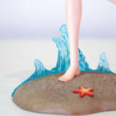 The Shoko Komi Beach Cosplay Figure by Spy × Family features a 30CM PVC portrayal of poised legs on a sandy base with blue wave sculptures, accented by a red starfish, making it an alluring addition for "Komi Can’t Communicate" anime collectors.