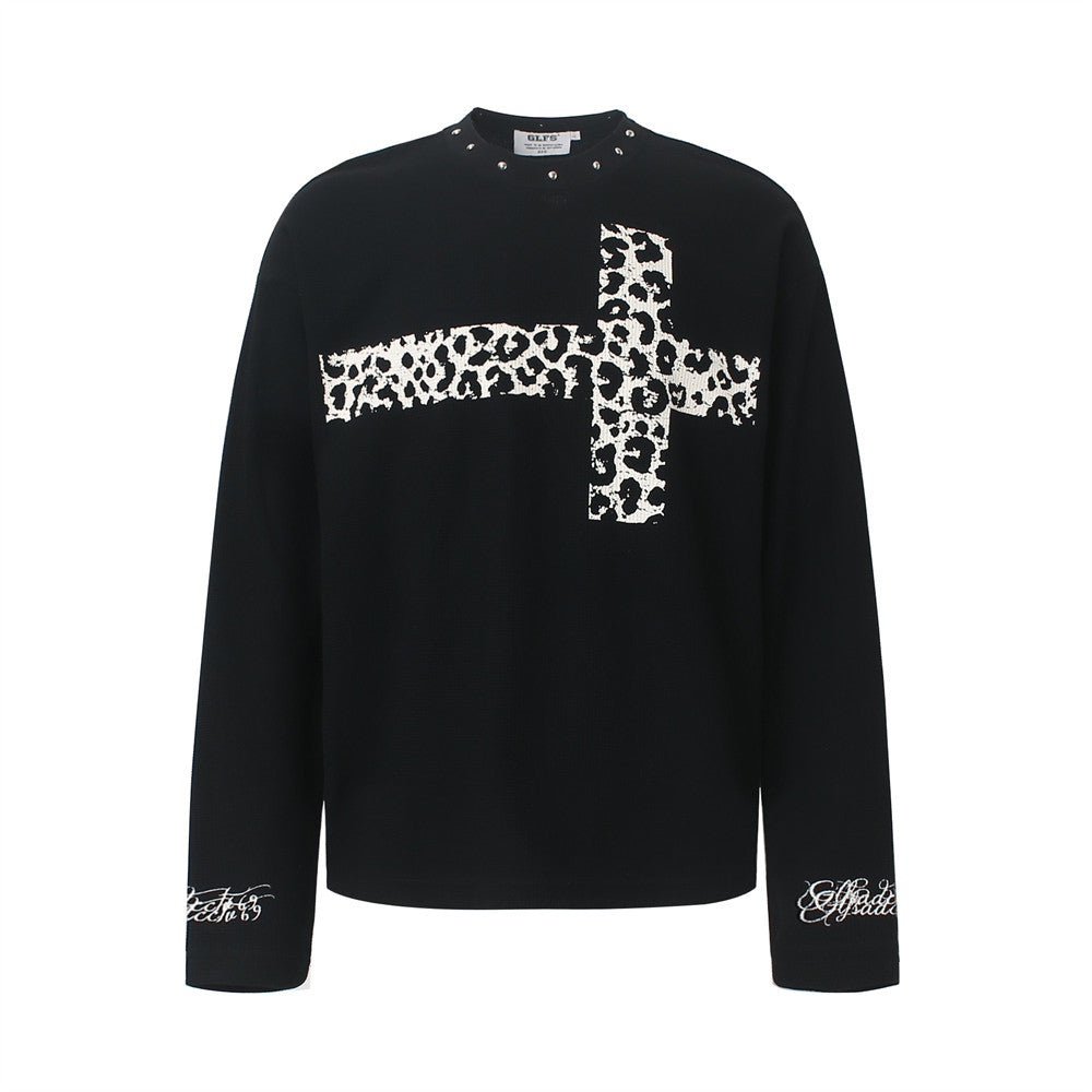 Men's black waffle-knit long sleeve shirt with leopard-print cross graphic and silver stud neckline detail