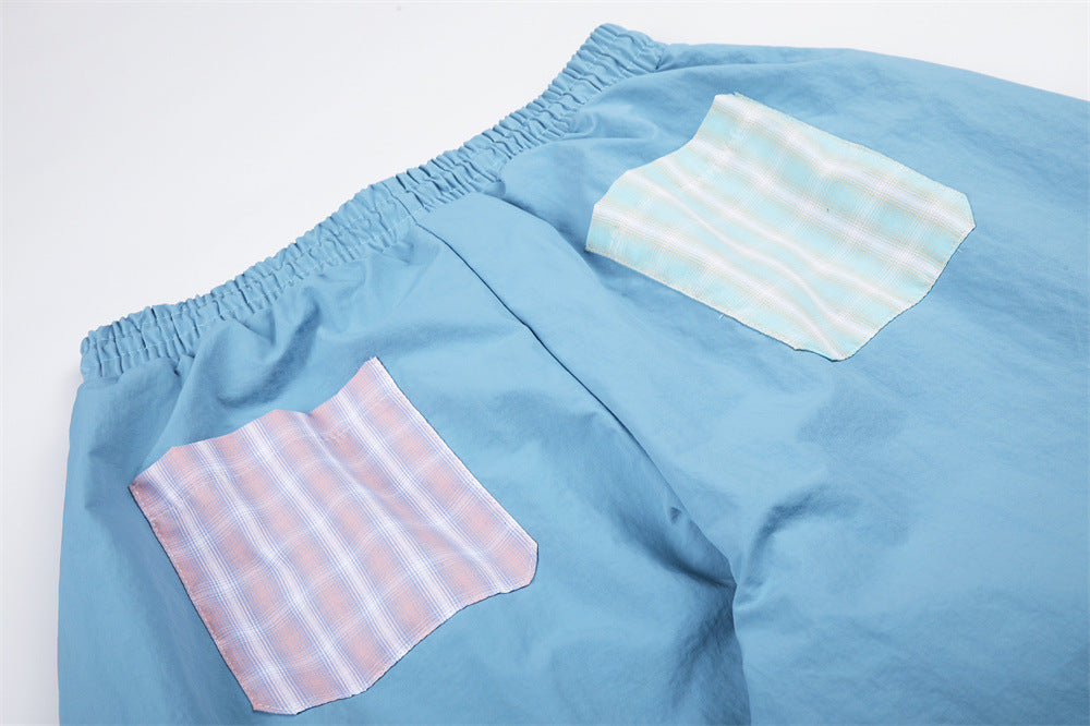 Colorblock Plaid Wide-Leg Parachute Pants with Script Embroidery