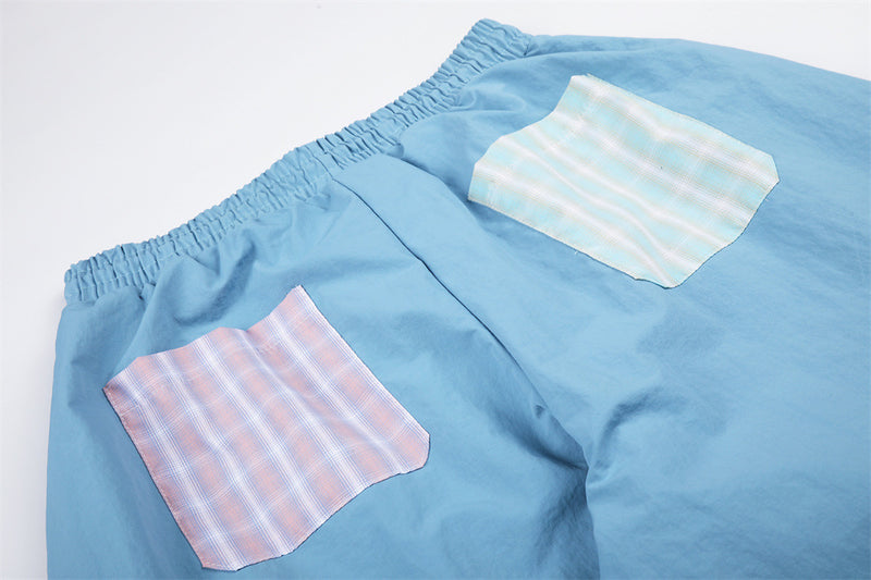 Colorblock Plaid Wide-Leg Parachute Pants with Script Embroidery