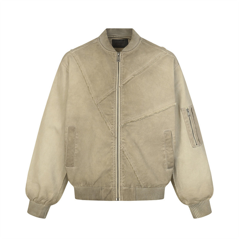 Blouson bomber oversize déconstruit en toile délavée, assemblage patchwork et coutures à bords francs, présenté en gris et kaki