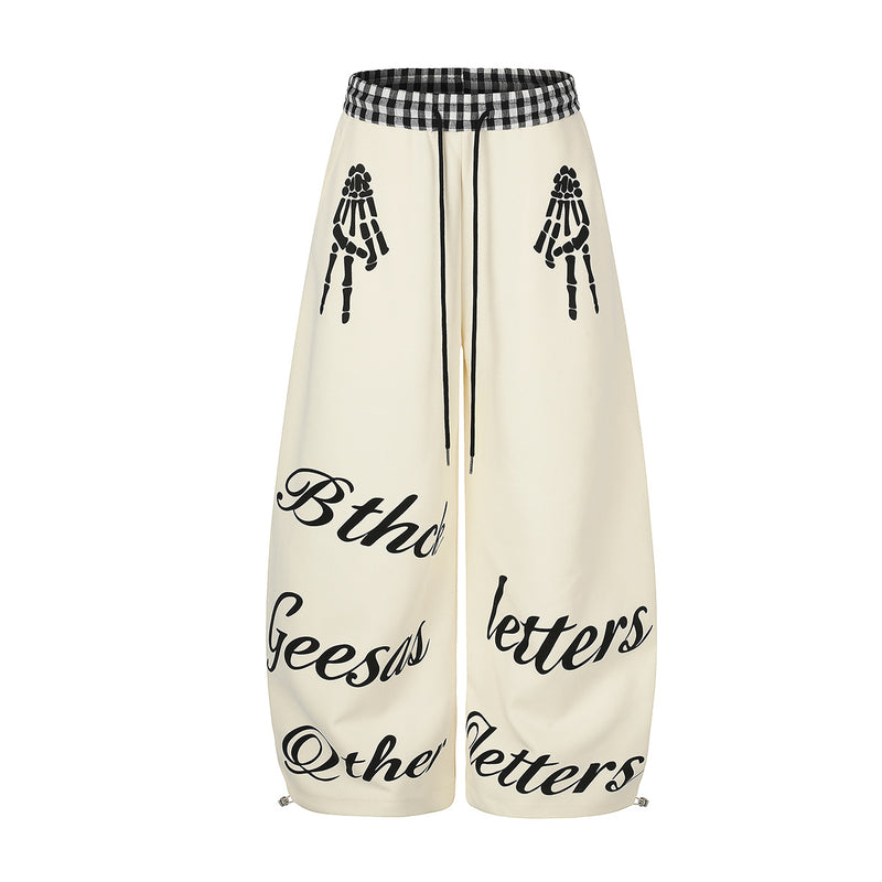 Pantalon de survêtement à jambes larges, imprimé main squelette et taille vichy