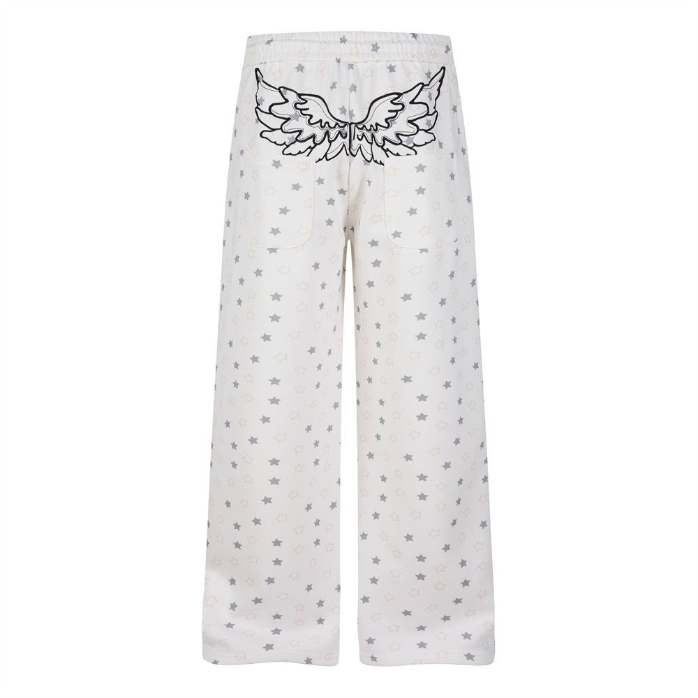 Pantalon de survêtement à jambes larges, imprimé étoiles, avec ailes d’ange et broderie de lettres