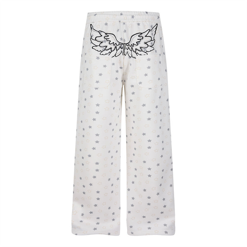 Pantalon de survêtement à jambes larges, imprimé étoiles, avec ailes d’ange et broderie de lettres
