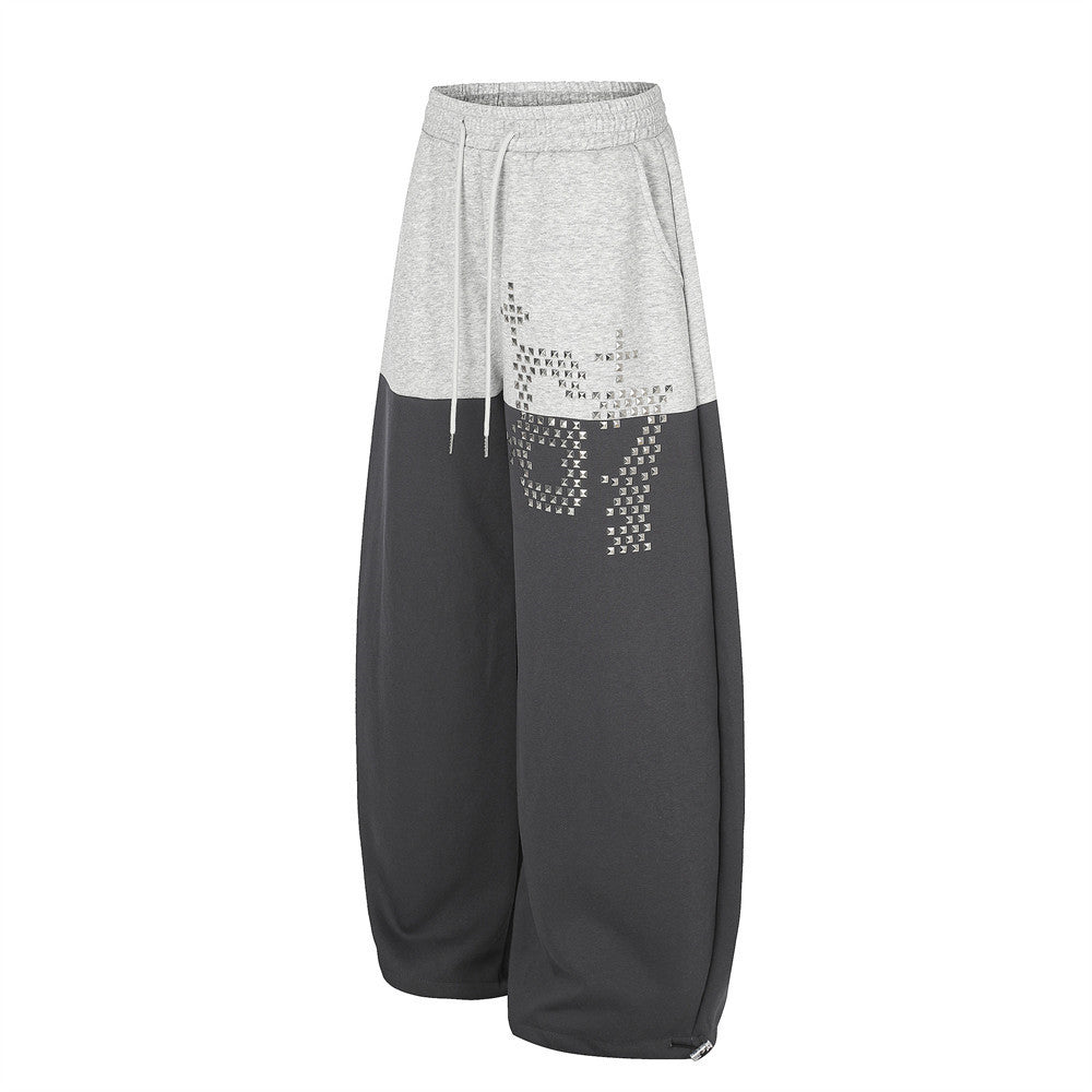 Pantalones de Chándal de Pierna Ancha con Bloques de Color y Detalles Gráficos de Tachuelas Plateadas