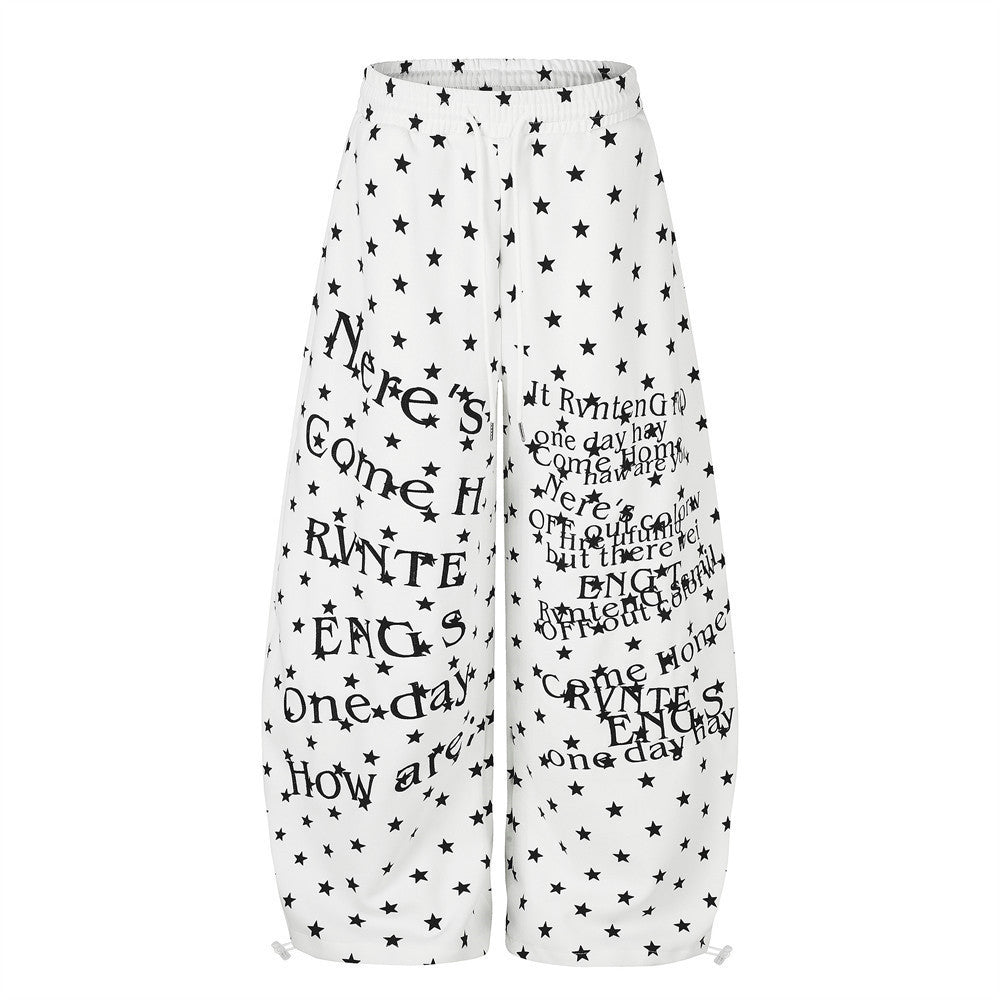 Men's wide-leg baggy pants with all-over star and letter print in white and navy colorways