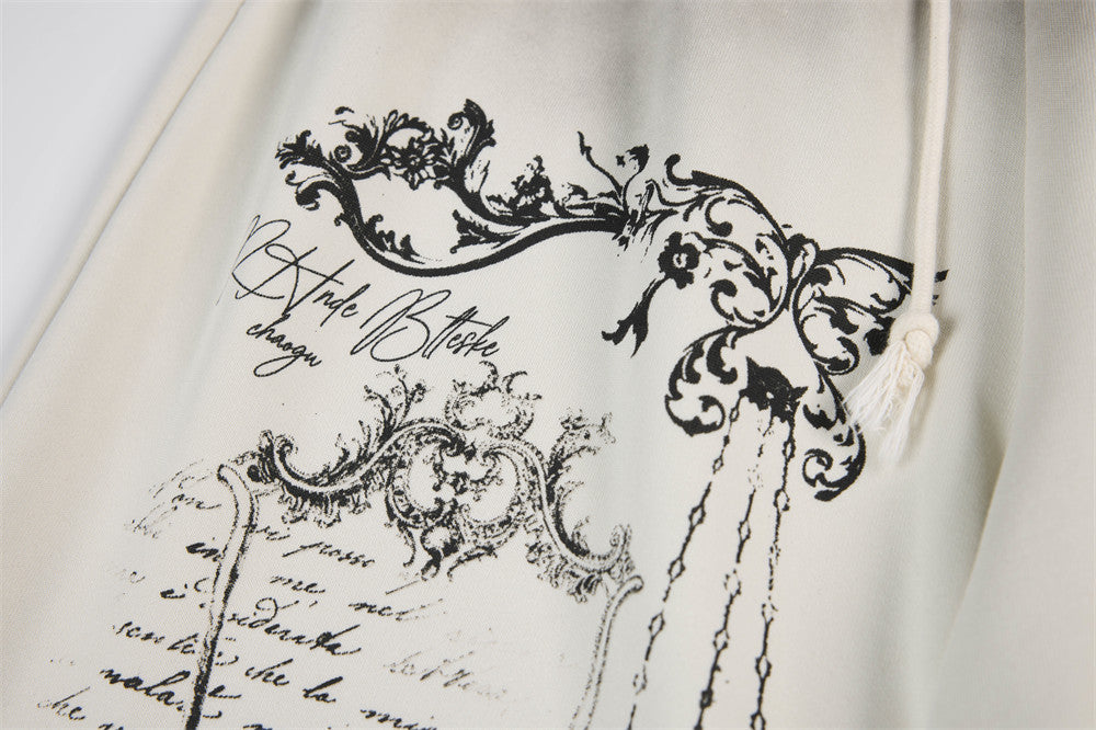 Pantalon de survêtement à jambes larges motif baroque – Imprimé usé, ceinture à étoiles