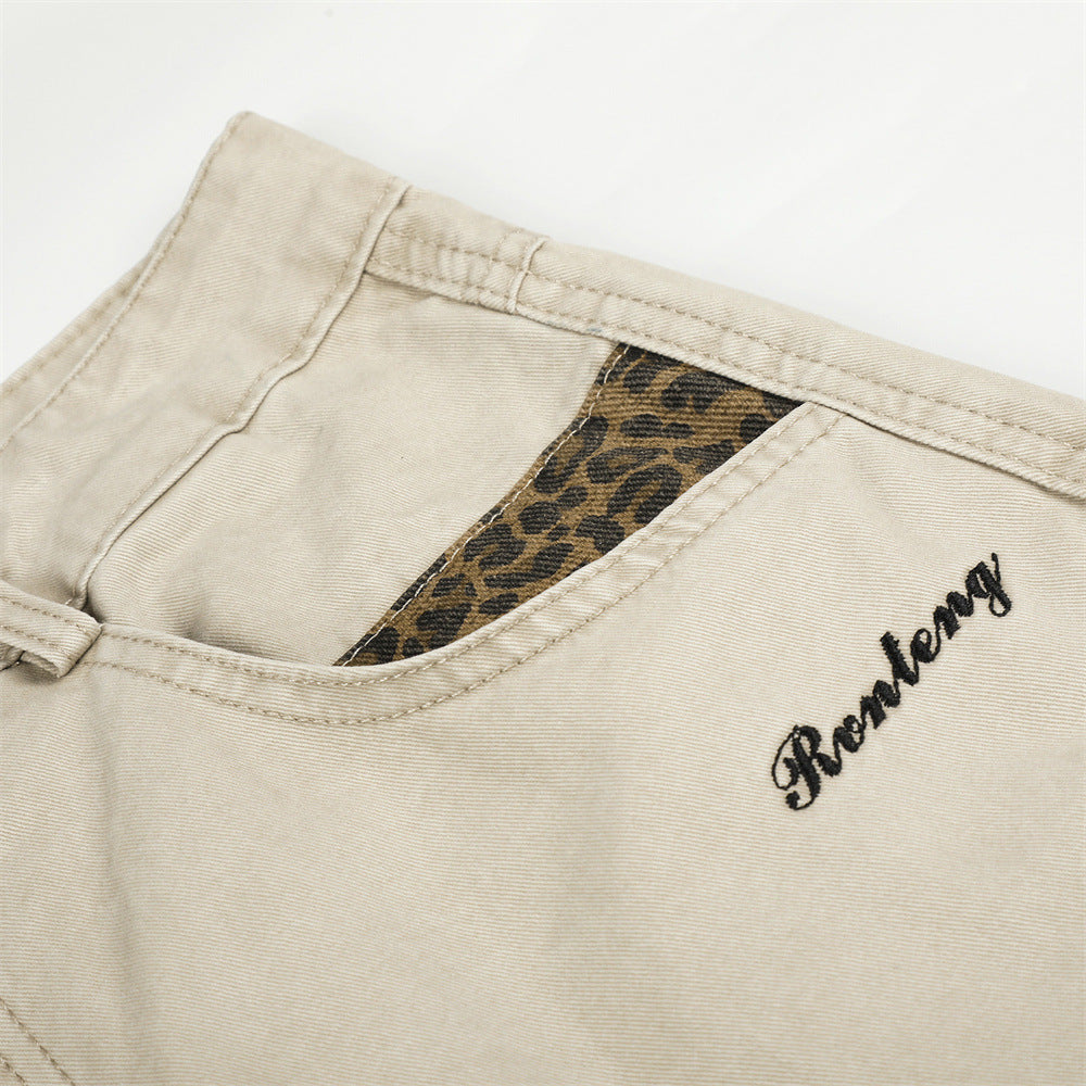 Pantalones de Pierna Ancha con Patchwork de Leopardo – Corte Baggy Deconstruido y Bajo Curvado