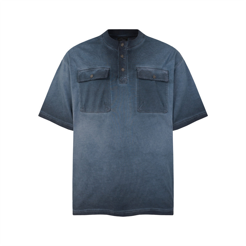Oversized acid wash Henley t-shirt with dual chest pockets and gradient fade in slate blue, front view