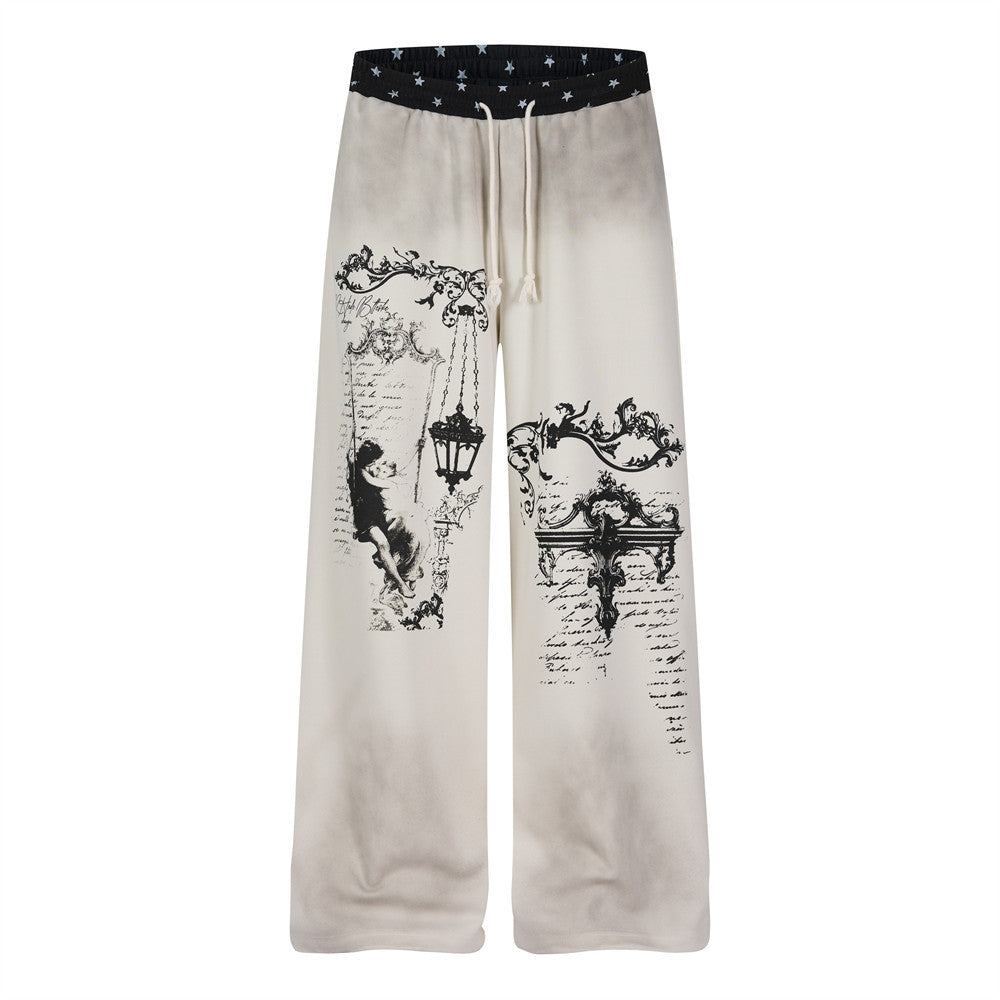Pantalon de survêtement homme crème à jambes larges, imprimé graphique baroque, délavage effet usé et ceinture élastique imprimée d’étoiles noires