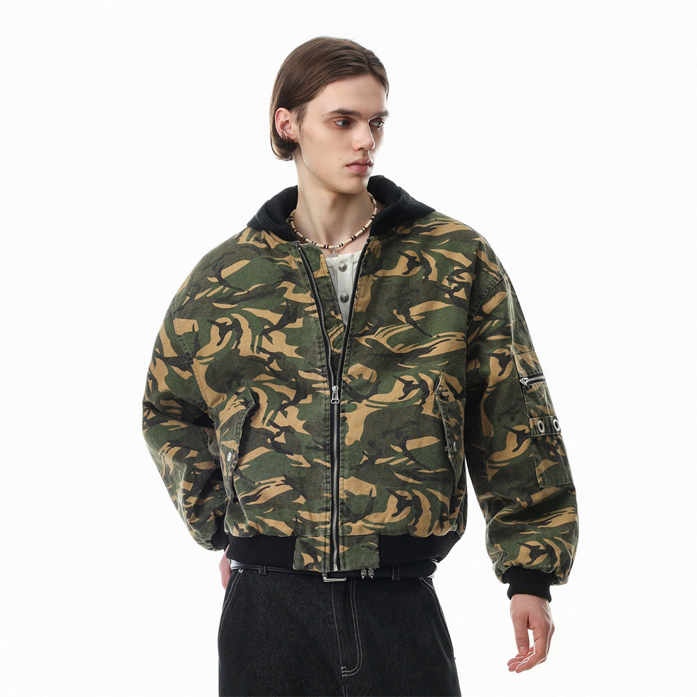 Men's oversized camouflage hooded padded bomber jacket with black hood, ribbed cuffs, and metal grommet details