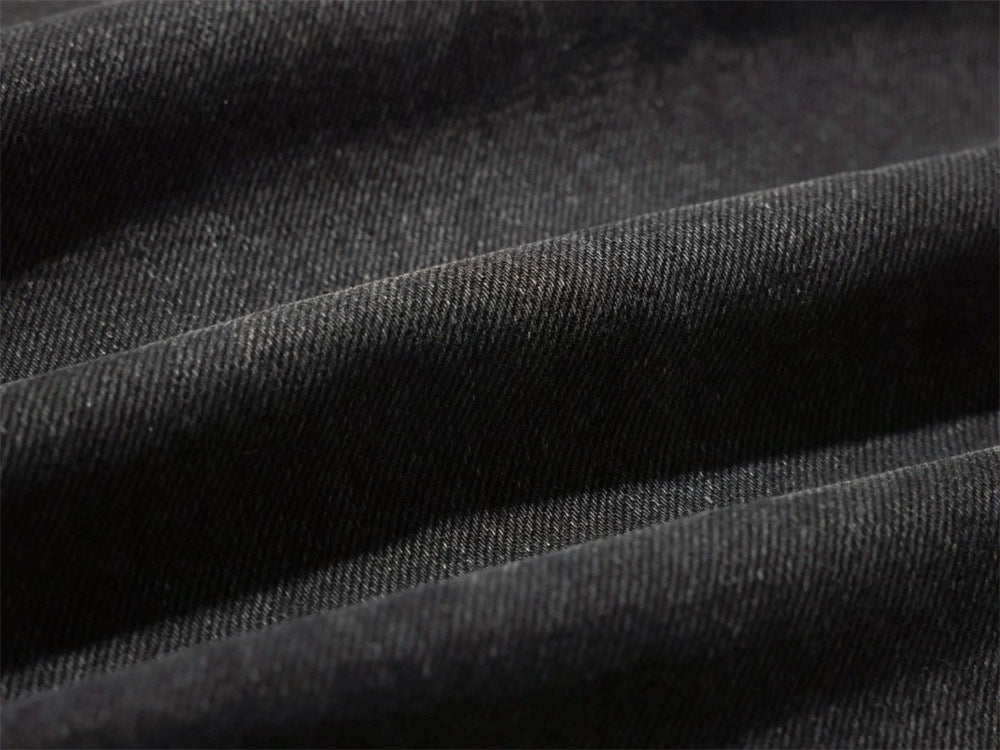 Close-up of black denim fabric texture