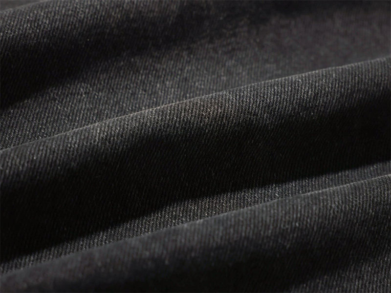 Close-up of black denim fabric texture