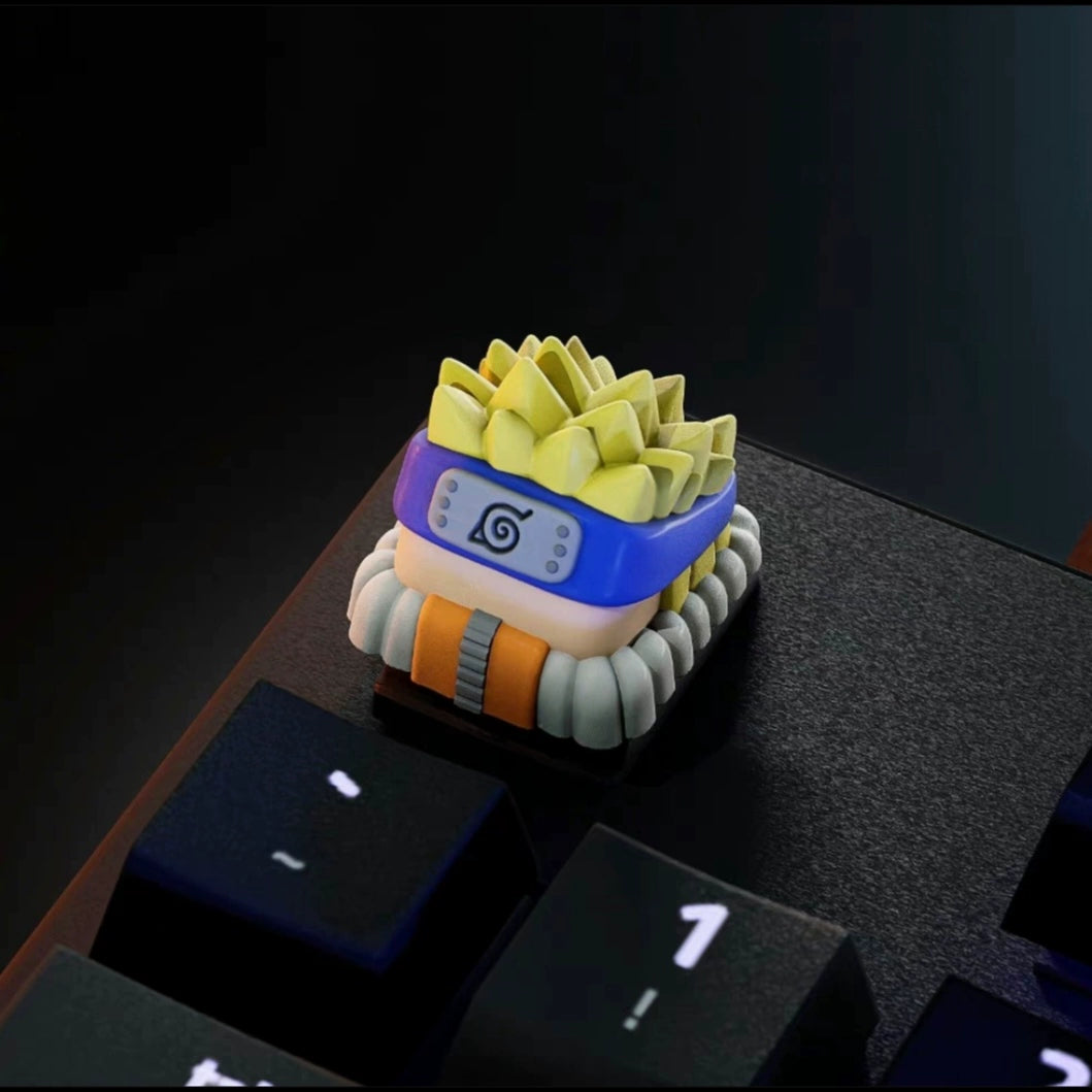 The Naruto Keycaps Set from the Naruto brand is a premium addition for any anime fan, featuring a custom keycap inspired by an anime headband. Adorned with a blue band, white emblem, and yellow spiky hair, it fits perfectly next to the &quot;1&quot; key in your Naruto collection.