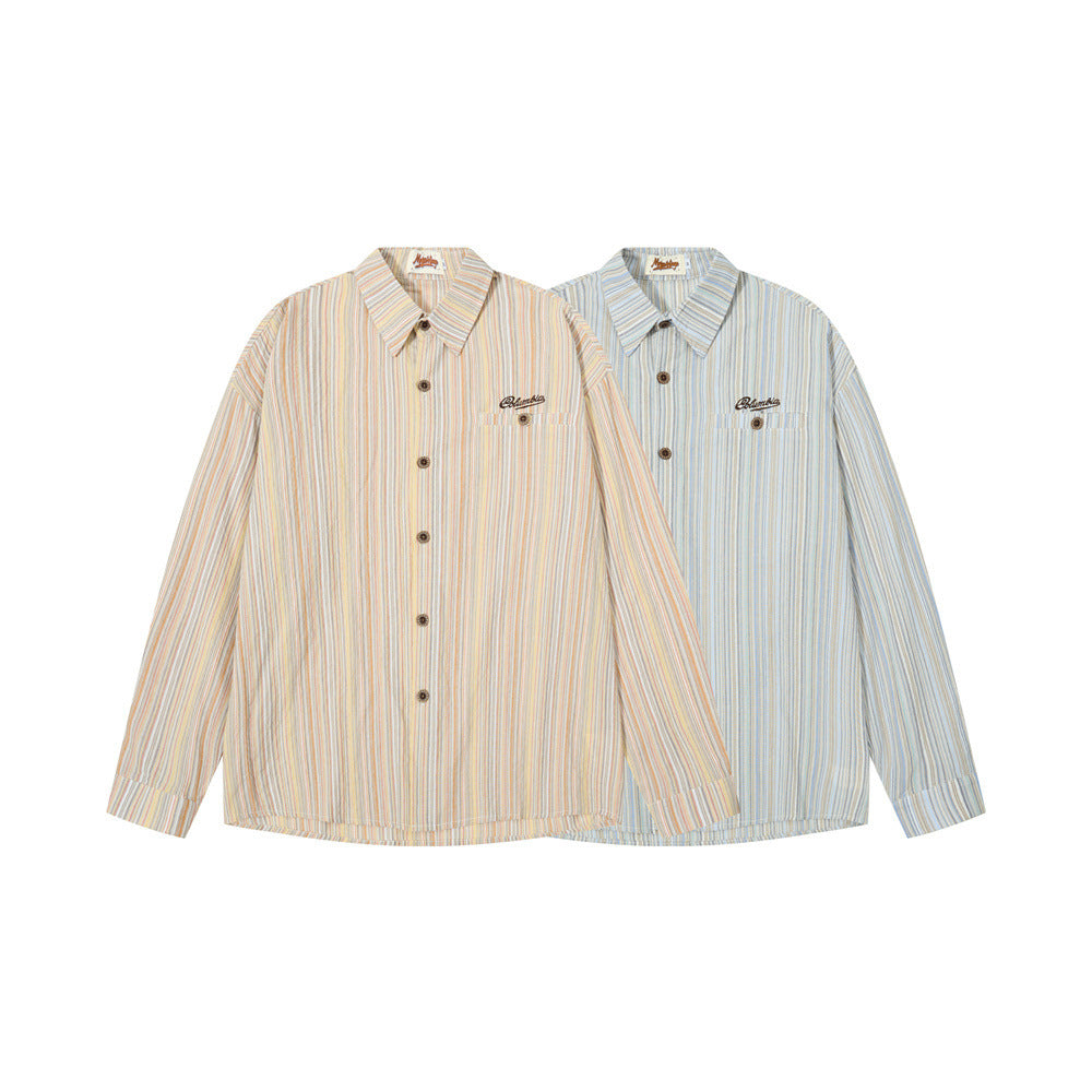 Two striped long sleeve button-up shirts, one beige and one light blue, with chest embroidery