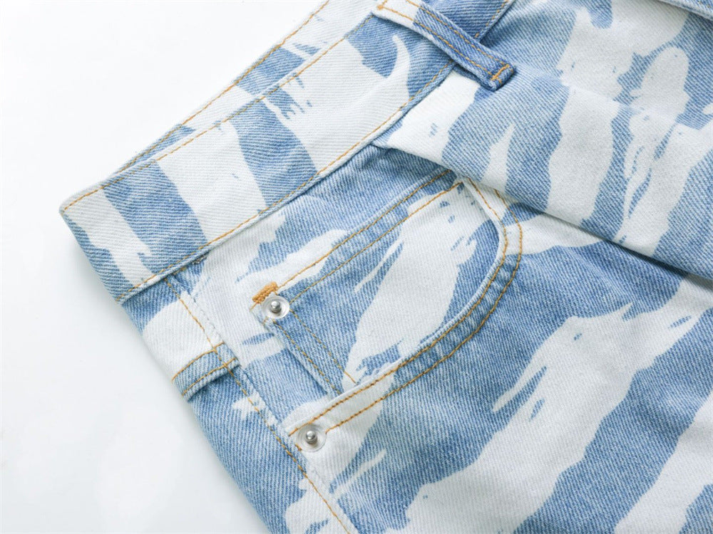 Close-up of back pocket and side seam on light blue zebra camo jeans